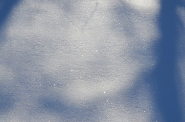 Blue colored Winter snow with shadows