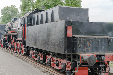Fototapeta na wymiar Vintage black steam locomotive old train