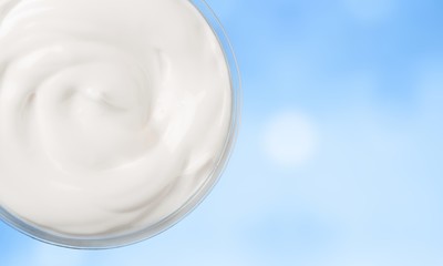 close up of a white beauty cream or yogurt on white background