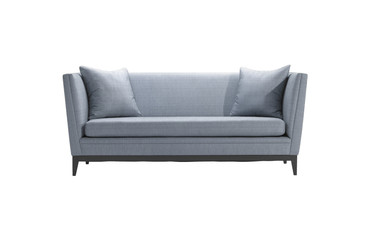 Plain sofa and pillow in same blue color isolated on white background with clipping path.