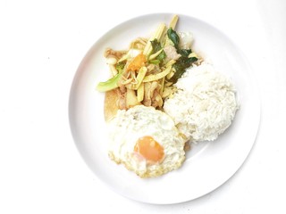 Stir fry chicken, sweet peppers, corn, broccoli, sweet basil and green beans with rice and fried egg in ธhai style in white dish on white background. Thai style food.