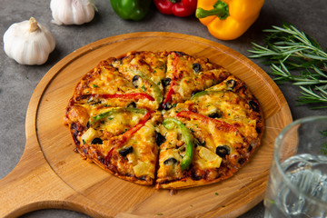 Fresh pizza with tomato.