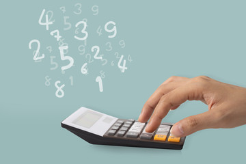 Hand using a calculator to calculate the numbers, Idea concept