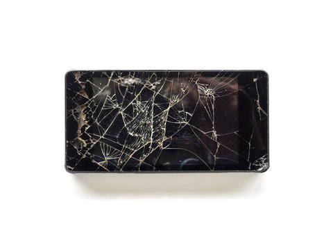 Top view of broken touch screen smart phone isolated on white background