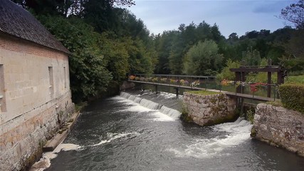 River and waterfall in Broglie, Normandy France