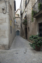 Fototapeta na wymiar Small medieval street in Girona city, Catalonia, Spain