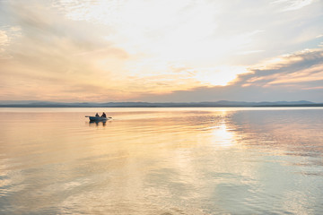 Boat on the river or lake  during sunset