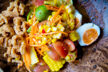 Som Tum ,Corn papaya salad  spicy Thai food.orn salad with mixed dried shrimp or dried salted prawn (same papaya salad or som tum thai)