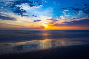 Fototapeta na wymiar Amazing colorful sunrise at sea, long exposure