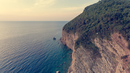 Fototapeta na wymiar Aeriel view point of sheer cliffs raising from the sea.