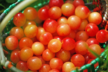 Fototapeta na wymiar fresh yellow pink cherry in basket top view
