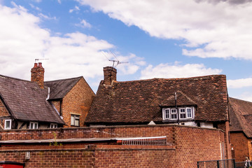 Vintage red brick rural buildings in English style