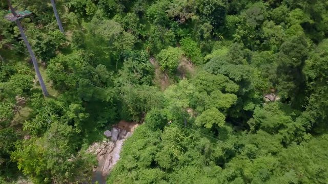 Aerial View of Tourists Riding on Zipline or Canopy Rope. Adrenaline Adventure on Vacation