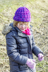 Child plays outside in winter