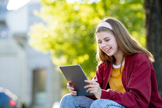 Young girl student with tablet