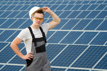 Solar panels engineer with white cask