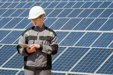 Solar panels engineer in white cask