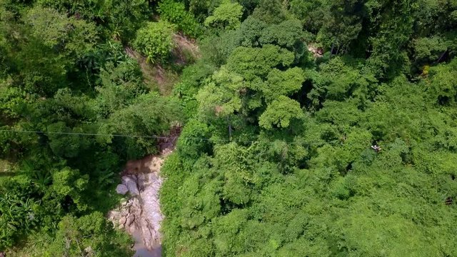 Aerial View of Tourists Riding on Zipline or Canopy Rope. Adrenaline Adventure on Vacation