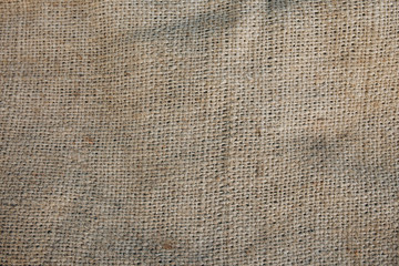 Old vintage linen cloth textile. Burlap rustic tumbled texture background.