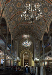 Tourists visiting and photographing the interior of the synagogue Coral in Bucharest city in Romania
