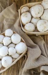 Fresh champignon mushrooms in a basket