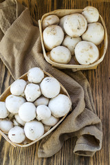 Fresh champignon mushrooms in a basket