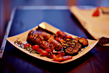 dinner at a restaurant grilled salmon / concept of a Mediterranean diet, seafood grilled and vegetables