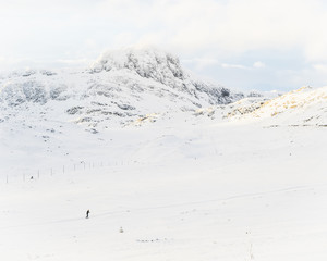 Skier in a snow covered mountain landscape in Beitosl&oslash;len Norway
