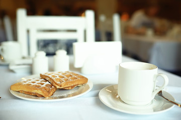 cup of coffee for breakfast in a cafe / serving cup of coffee in modern interior, a European breakfast