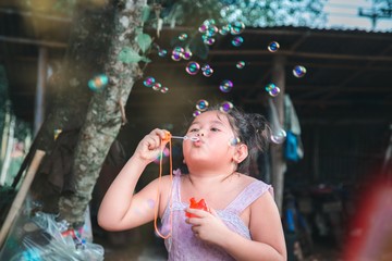 Portrait Happy child with bubbles 
