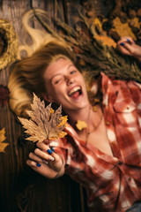 Autumnal foliage. Place for your text. Advertisement concept. Gold Background. Hello September. Happy smiling woman. Sensual girl. Model face. Beauty face. Fashion girls. Autumn leaves.