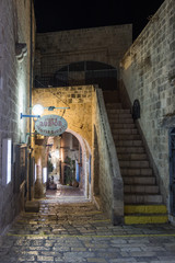 A sign with the name of the street in Hebrew - Lane of the sign of the zodiac Pisces in on old city...