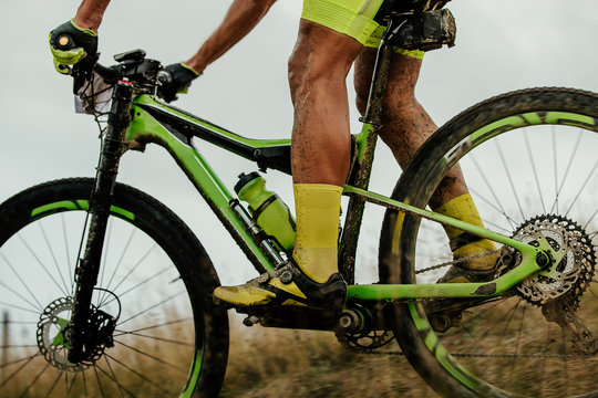 Dirty Feet Athlete Cyclist Rides On Mountainbike With Water Bottle