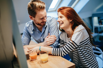 Couple in love talking smiling at home