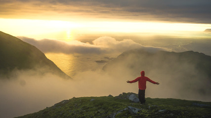 Male hiker walking on top of mountain looking at beauty morning landscape. Man hiking silhouette....