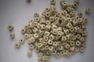 cubes beads letters alphabet / background of wooden cubes with alphabet letters, concept education reading, learning letters