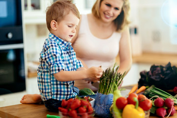 Mother and child preparing lunch