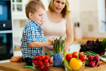 Mother and child preparing lunch