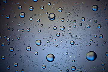 gray wet background / raindrops to overlay on the window, weather, background drops of water rain on the glass transparent