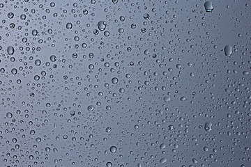 gray wet background / raindrops to overlay on the window, weather, background drops of water rain on the glass transparent