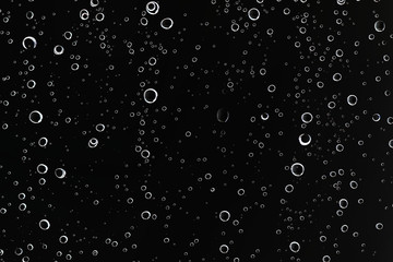 black wet background / raindrops for overlaying on window, concept of autumn weather, background of...