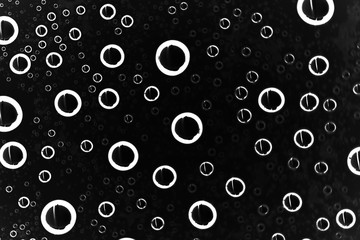 black wet background / raindrops for overlaying on window, concept of autumn weather, background of drops of water rain on glass transparent