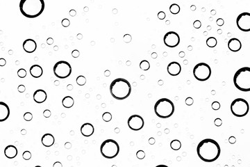 white isolated background water drops on the glass / wet window glass with splashes and drops of water and lime, texture autumn background
