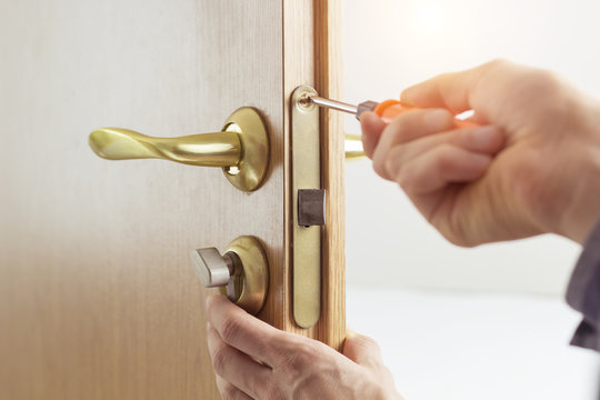 Hands Repair The Door Lock.