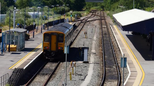 Train at platform, with train pulling on to patform Carmarthen Wales