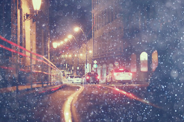 snow transport road city / landscape in a night city in winter, cars on the road in traffic jam in cold weather, snow