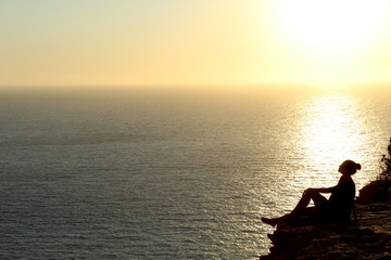 Naklejka na ściany i meble Sunset silhouettes during amazing golden sunset in Ibiza