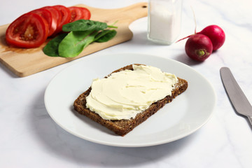 Dense rye whole-grain rye bread with creamy cheese
