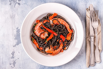Black spaghetti with prawns and vegetables