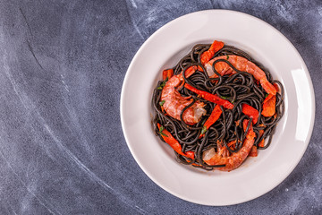Black spaghetti with prawns and vegetables